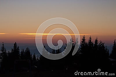 Silent morning in Carpathian montains. Forest silhouettes in mountains at dawn. Vasness and peace concept. Stock Photo