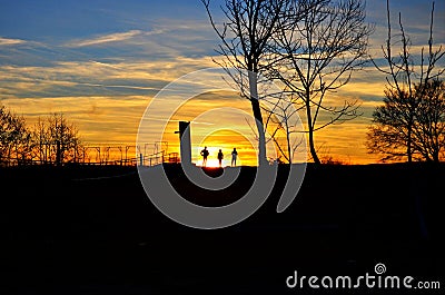 Silhouete people at sunset Stock Photo