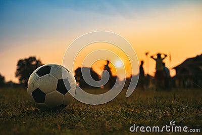 Silhouette action sport outdoors of diversity of kids playing soccer football Stock Photo