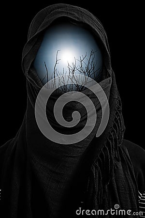 Silhouette against sun in black veil with dark environment Stock Photo