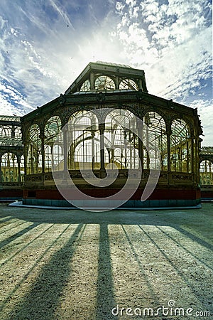 Silhouette against the sun of the Palacio de Cristal in Madrid's Retiro public park, Stock Photo