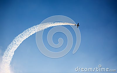 Silhouette of an airplane performing flight at airshow Stock Photo