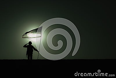Silhouette of saluting US army soldier with flag Stock Photo