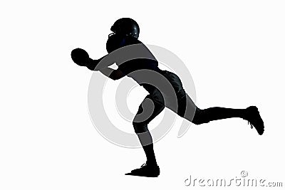 Silhouette American football player catching ball Stock Photo