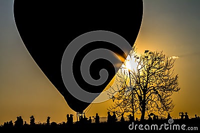 Silhouette balloon with the light of the evening sun beautiful. Stock Photo