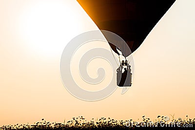 Silhouette balloon floating in the air, the sun in the evening. Stock Photo