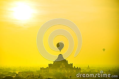 Silhouette balloon over a pagoda field Stock Photo