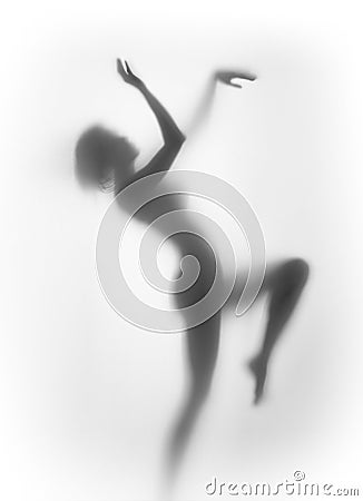 Silhouette of a beautiful, sexy, pretty woman body, dancing. Stock Photo