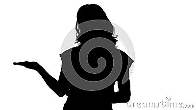 Silhouette Beautiful woman presenting something with her hands showing from her left and right. Stock Photo