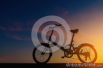 Silhouette bicycle on dramatic sky Stock Photo