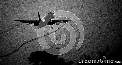Silhouette of the big plane landing Stock Photo