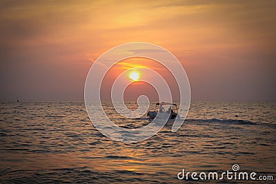 Silhouette Boat in the sea Stock Photo