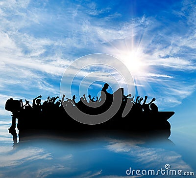 Silhouette of boats with refugees Stock Photo