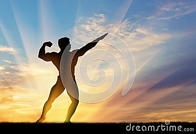 Silhouette of bodybuilder poses at sunset Stock Photo