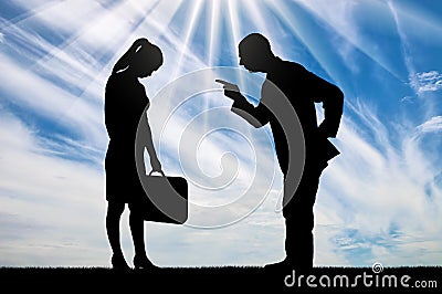 Silhouette of a boss yelling at a female employee with her head bowed Stock Photo