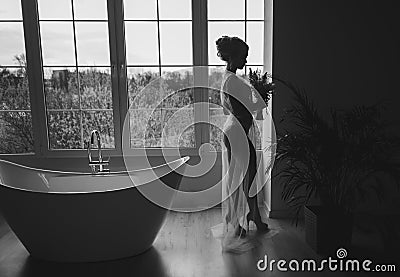 Silhouette of the bride with a bouquet Stock Photo