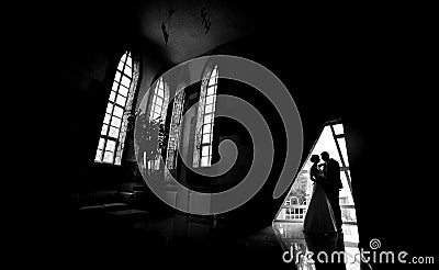 Silhouette of a bride and groom Stock Photo