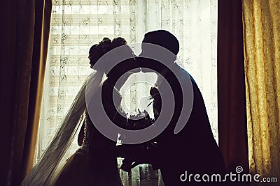 Silhouette of bride and groom Stock Photo