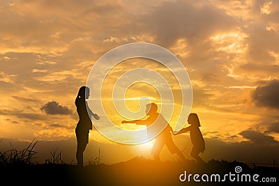 Silhouette of Brother and sister ran to mother at sunset background, Happy Mother and child Concept Stock Photo