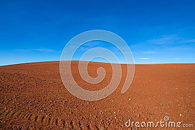 Silhouette of brown earth field hill and blue sky Stock Photo