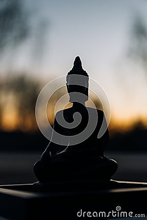 Silhouette of Buddha, Buddhist shadow with wisdom enlighten light spread. Stock Photo