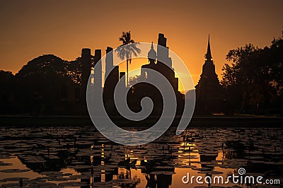 Silhouette at of Buddha and pagoda on sunset time at Sukhothai History park,Thailand. Thailand tourism concept, Asia traveling Stock Photo
