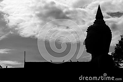 Silhouette Buddha statue with sky background, abstract wallpaper Stock Photo