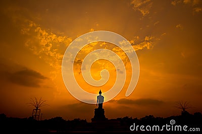 Silhouette Buddha statue in the sunset Stock Photo