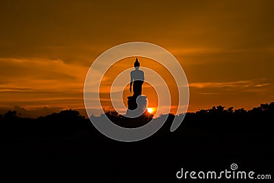 Silhouette Buddha with sunset background Stock Photo