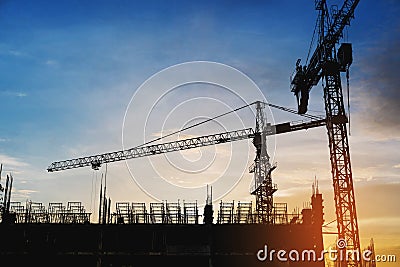 Silhouette building construction site in sunset Stock Photo