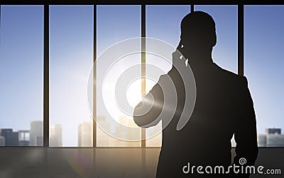 Silhouette of business man calling on smartphone Stock Photo