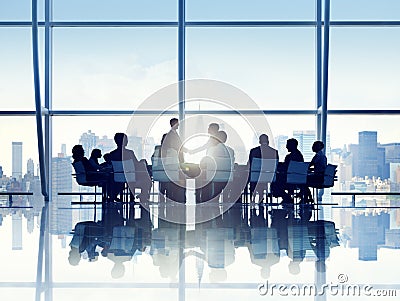 Silhouette of Business Person in a Board Room Stock Photo