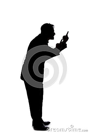 Silhouette of a Businessman Acting Angry Stock Photo