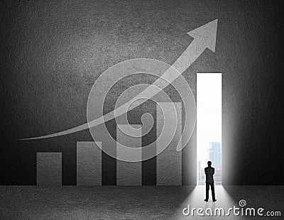 Silhouette of businessman stand in front of the growth chart Stock Photo