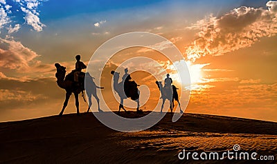 Silhouette camel caravan at the Thar desert Jaisalmer, Rajasthan India at sunset Stock Photo