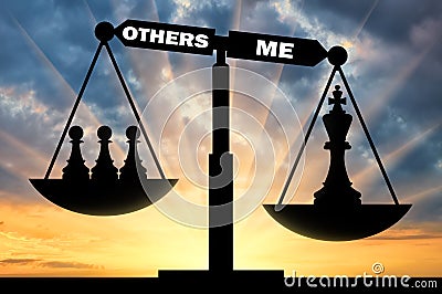 Silhouette of a chess figure queen in priority over the three pawns on the scales Stock Photo