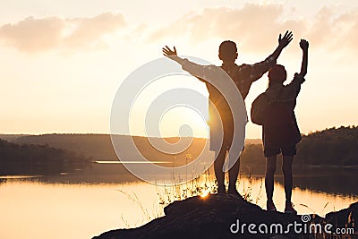 Silhouette of children backpack in nature Stock Photo