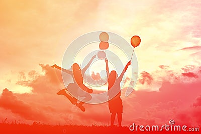 Silhouette children with balloon Stock Photo