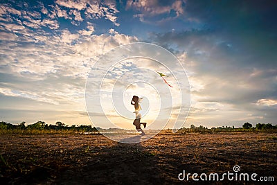 Silhouette of children flying a kite on sunset Editorial Stock Photo