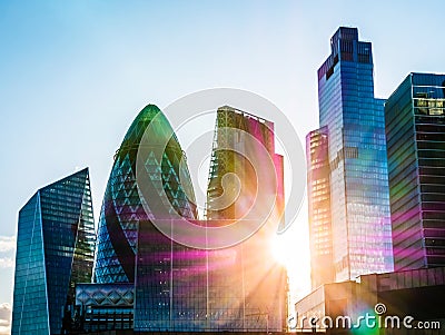 Silhouette of City finance area. Abstract and colourful rays of optical light flare break through. Editorial Stock Photo
