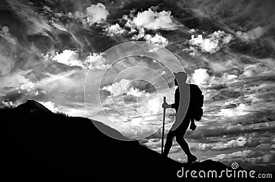 Silhouette climber ascending the mountain Stock Photo