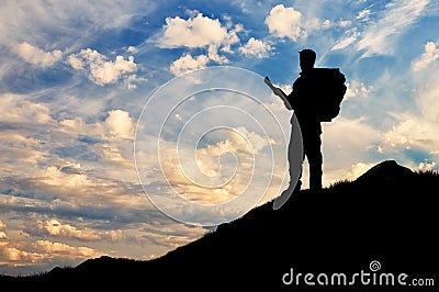 Silhouette climber ascending the mountain Stock Photo