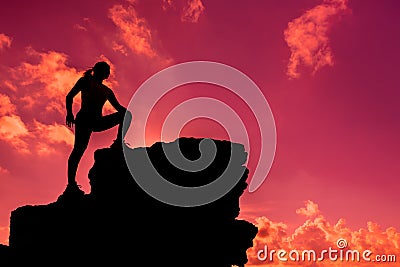 Silhouette climber on the cliff. Business Success and goal Stock Photo