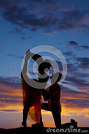 Silhouette couple dancing scorpion kneel Stock Photo