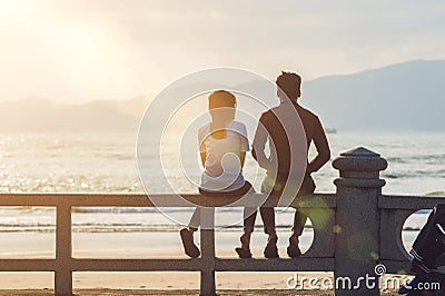 Silhouette of a couple in love at sunset Stock Photo