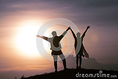 Silhouette romantic couple with sunset or sunrise Stock Photo