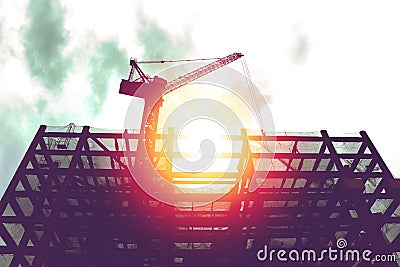 Silhouette of crane in building construction site Stock Photo