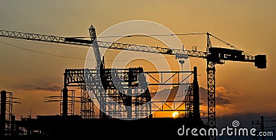 Silhouette crane building and sunset Stock Photo