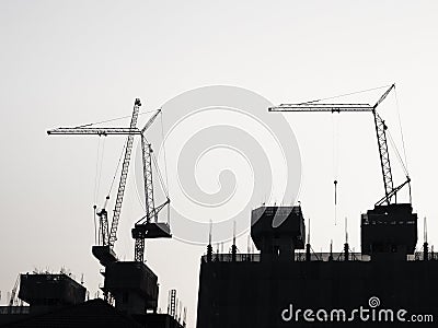 Silhouette Crane Industrial equipment Building construction Stock Photo