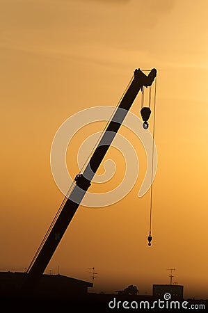 Silhouette crane working Stock Photo